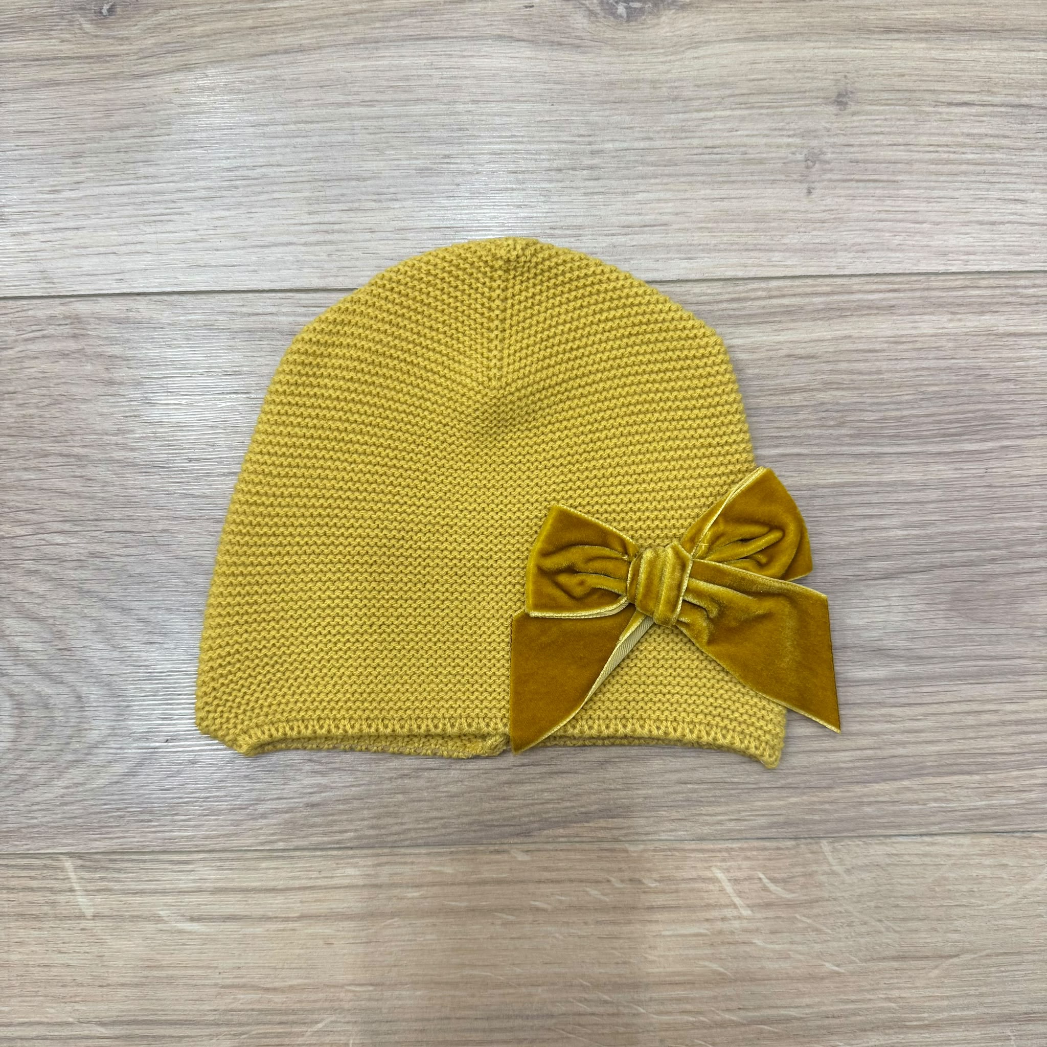 Condor cappellino con fiocco in velluto