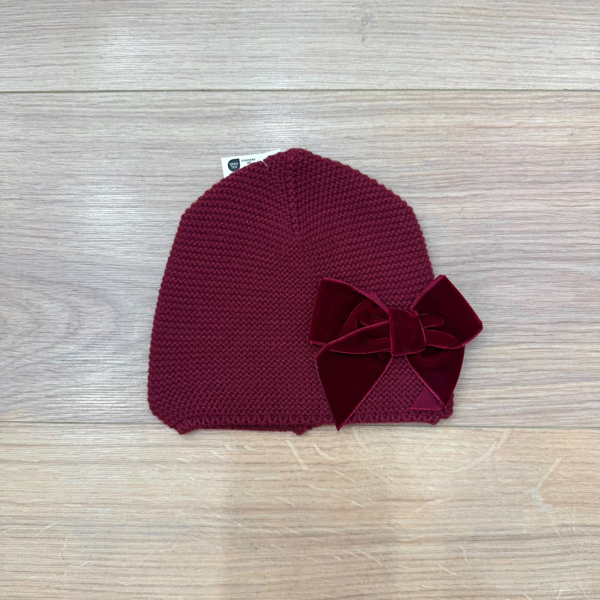 Condor cappellino con fiocco in velluto
