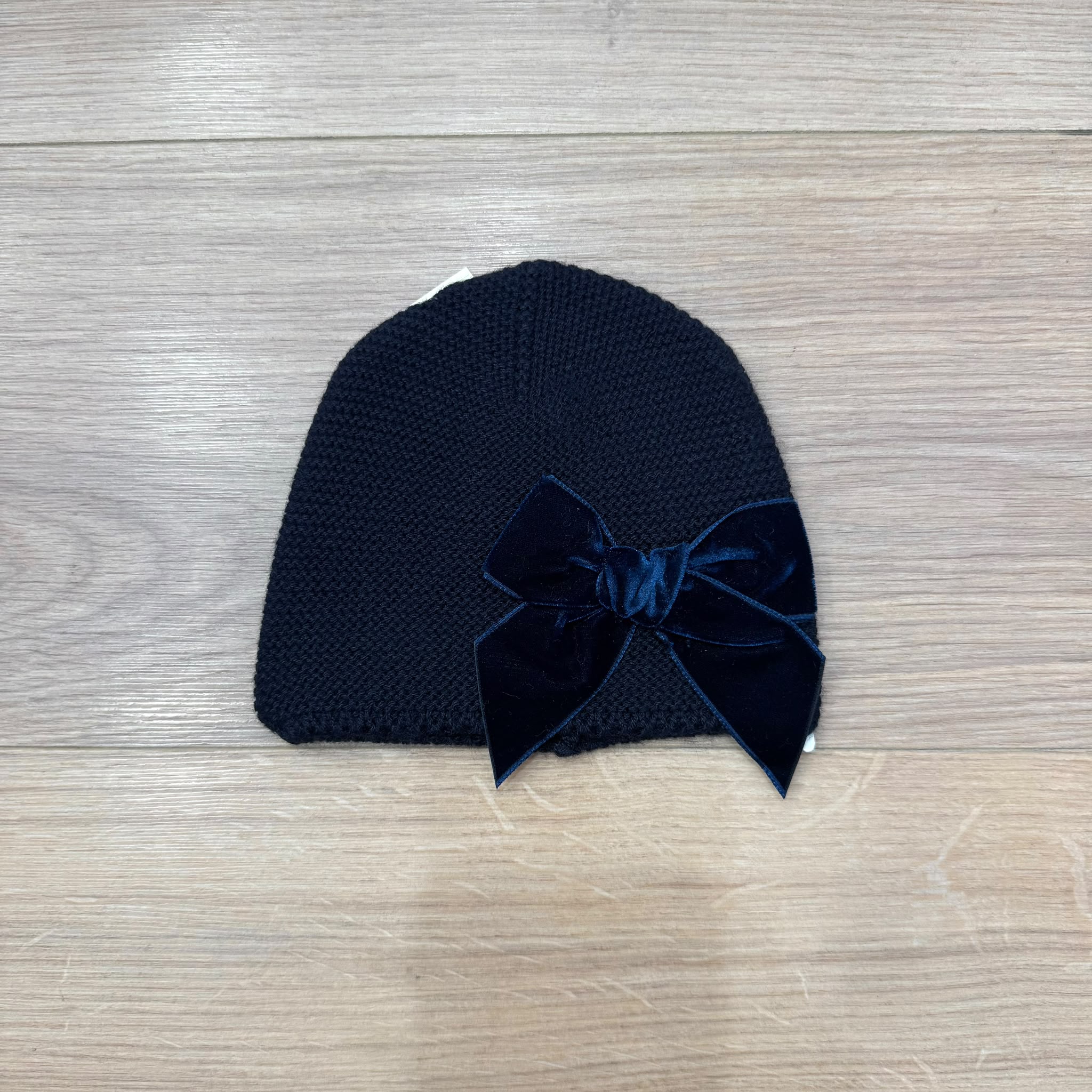 Condor cappellino con fiocco in velluto